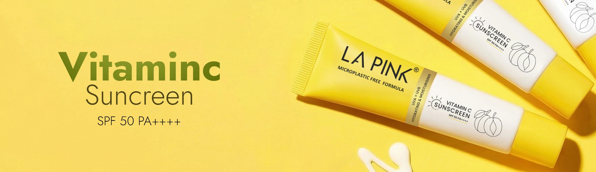 LA Pink Vitamin C Sunscreen packaging on a yellow background