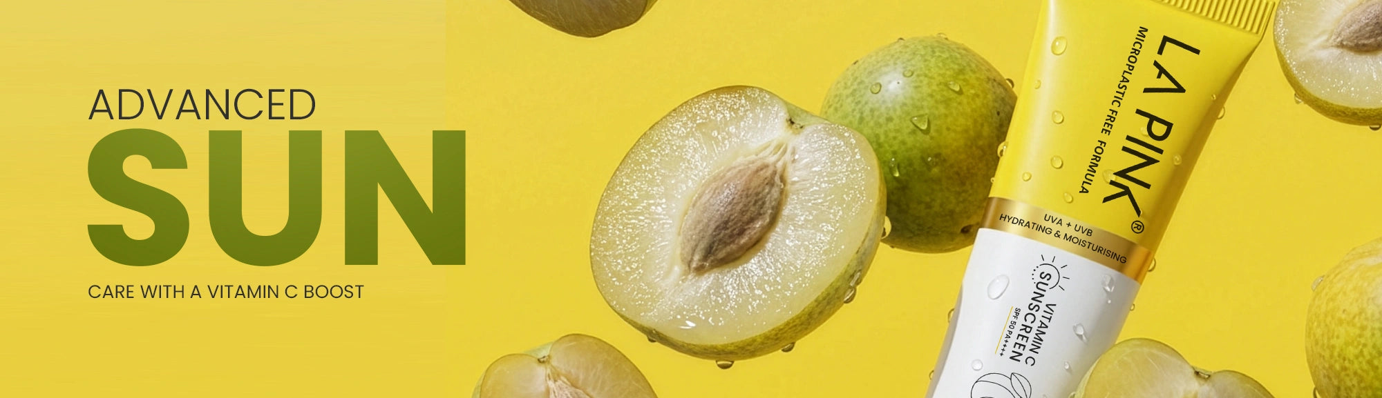 La Pink sunscreen tube with green fruit on a yellow background